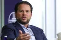 A stylized image of the Pinterest logo with a subtle overlay of a spreadsheet or data visualization, representing the layoff tracking tool and corporate data.