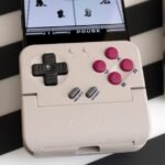 GameSir's Pocket Taco: The Ultimate Retro Gaming Revival for Your Smartphone 4 GameSir Pocket Taco controller attached to a smartphone, showcasing its retro Game Boy-like buttons and D-pad