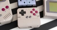 GameSir Pocket Taco controller attached to a smartphone, showcasing its retro Game Boy-like buttons and D-pad