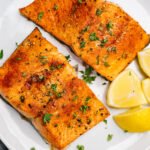 Beyond the Bird: 5 Unexpected Protein Powerhouses to Diversify Your Diet 4 A vibrant selection of high-protein foods including salmon, cottage cheese, tofu, tuna, and shrimp, arranged appealingly on a table.
