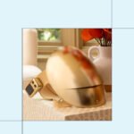 A person wearing the Sunlighten RED Light Therapy Mask, highlighting its full-face coverage and sleek design.