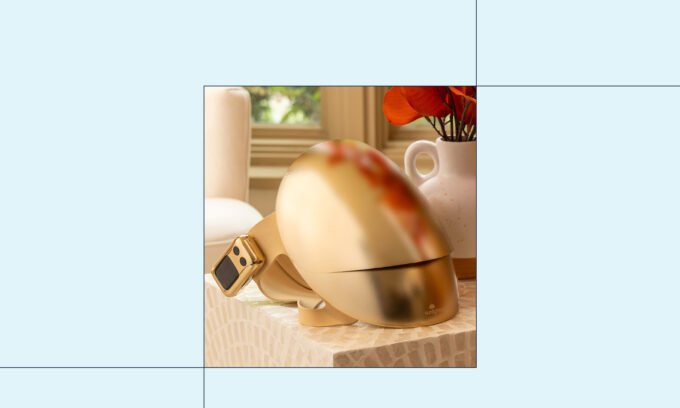 A person wearing the Sunlighten RED Light Therapy Mask, highlighting its full-face coverage and sleek design.