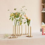 Daniel Rybakken's Reflet Candle Holder for Eldvarm, a modern brass design inspired by Scandinavian light rituals.