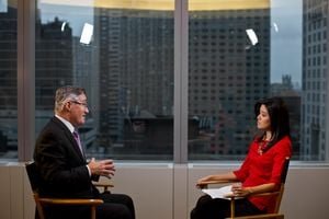 Professional looking at a laptop screen, surrounded by job application icons, symbolizing the complex modern job search and reverse recruiting.