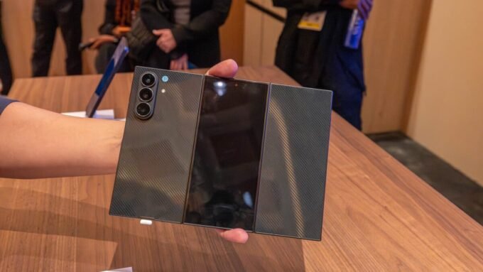 A sleek, unfolded Samsung Galaxy Z TriFold smartphone displaying its large, twice-folding screen.