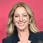 Sarah McLachlan smiling, perhaps with a thoughtful expression, representing her personal journey.