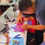 Students engaging in hands-on projects at the Gurnee District 56 School Maker Faire, demonstrating creativity and collaboration.