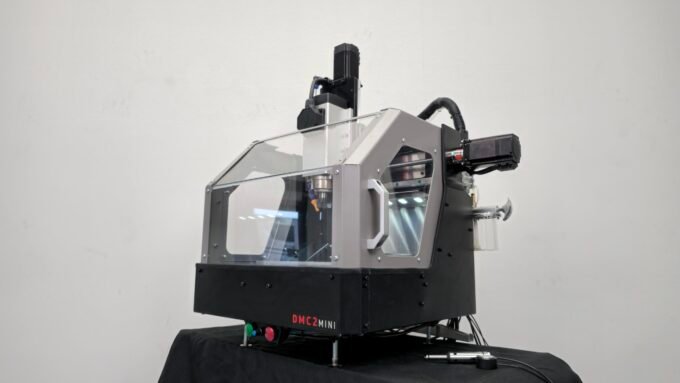 Shariff DMC2 Mini CNC Mill in action, cutting a metal workpiece.