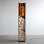 Simon Johns' FF Magma Lamp, a sculptural light fixture blending ceramic, glass, and walnut.