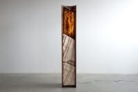 Simon Johns' FF Magma Lamp, a sculptural light fixture blending ceramic, glass, and walnut.