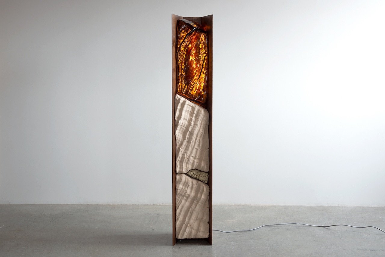 Simon Johns' FF Magma Lamp, a sculptural light fixture blending ceramic, glass, and walnut.