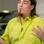 An autonomous drone racing through a course, representing Anduril's AI Grand Prix competition.