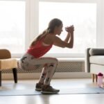 An athlete performing a squat, demonstrating proper depth