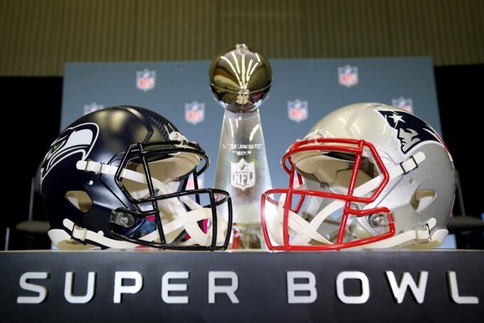 Super Bowl LX logo with New England Patriots and Seattle Seahawks helmets