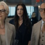 Meryl Streep as Miranda Priestly looking dismissive, with Anne Hathaway as Andy Sachs in the background, from The Devil Wears Prada 2 trailer.