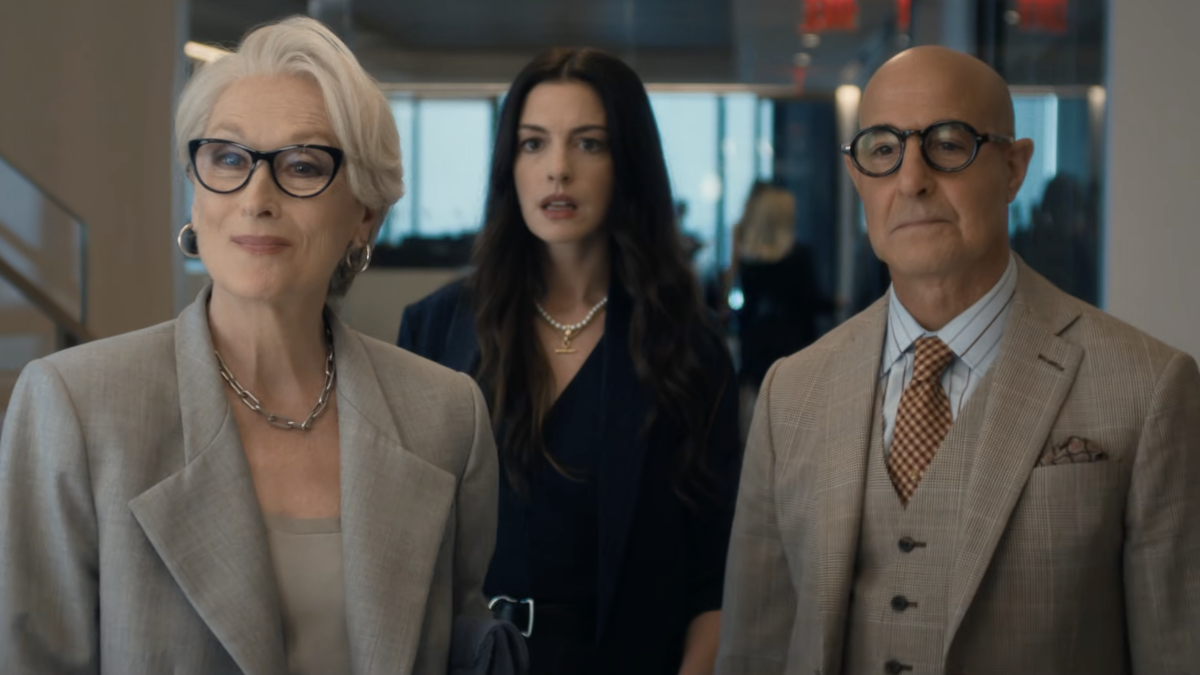Meryl Streep as Miranda Priestly looking dismissive, with Anne Hathaway as Andy Sachs in the background, from The Devil Wears Prada 2 trailer.