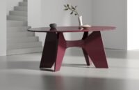 Tottolo table showcasing its uniquely carved legs and top, embodying playful, intuitive design.