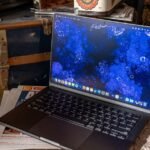 Apple's Next-Gen MacBook Pros: Touchscreens and Dynamic Island Set to Redefine the Laptop Experience 4 A conceptual image of an Apple MacBook Pro with a touchscreen and a Dynamic Island feature.