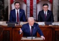 President Donald J. Trump addressing a joint session of Congress with Vice President JD Vance and Speaker Mike Johnson listening.
