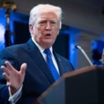 US President Donald Trump speaking at a podium, announcing new trade policies.