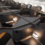 Modern, luxurious business class cabin interior with lie-flat seats on a new aircraft flying US-Asia routes