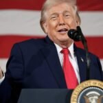 Trump Unleashes New 10% Global Tariff After Supreme Court Strikes Down Previous Levies 6 President Donald Trump signing an executive order on trade, with a globe icon in the background, symbolizing global tariffs.