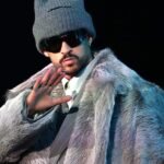 Bad Bunny performing at the Super Bowl halftime show, symbolizing the intersection of culture and US immigration politics and its impact on the upcoming midterm elections.