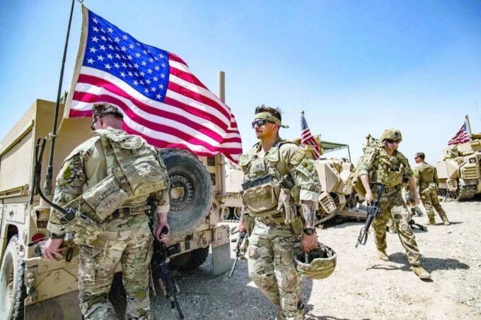 End of an Era: US Withdraws Final Troops from Syria, Reshaping Regional Dynamics 8 US troops with an American flag in Syria, symbolizing the end of a decade-long military presence.