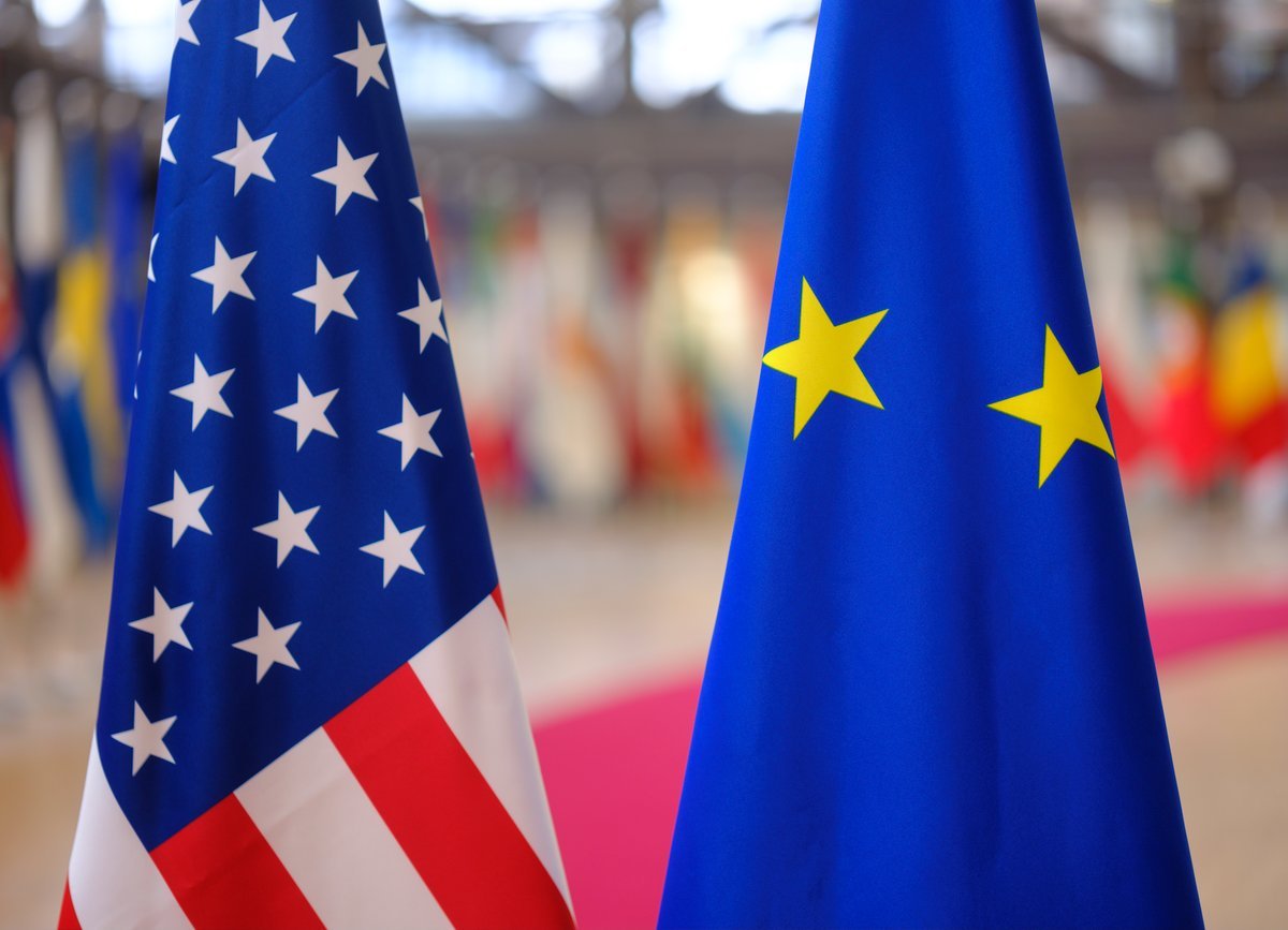 USA and EU flags side by side, symbolizing economic and political relations
