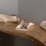 A collection of Virginia Sin's 'KEEP' ceramic organizers, including the Archiva tray, Formara, and Cache, displayed in a minimalist home setting.