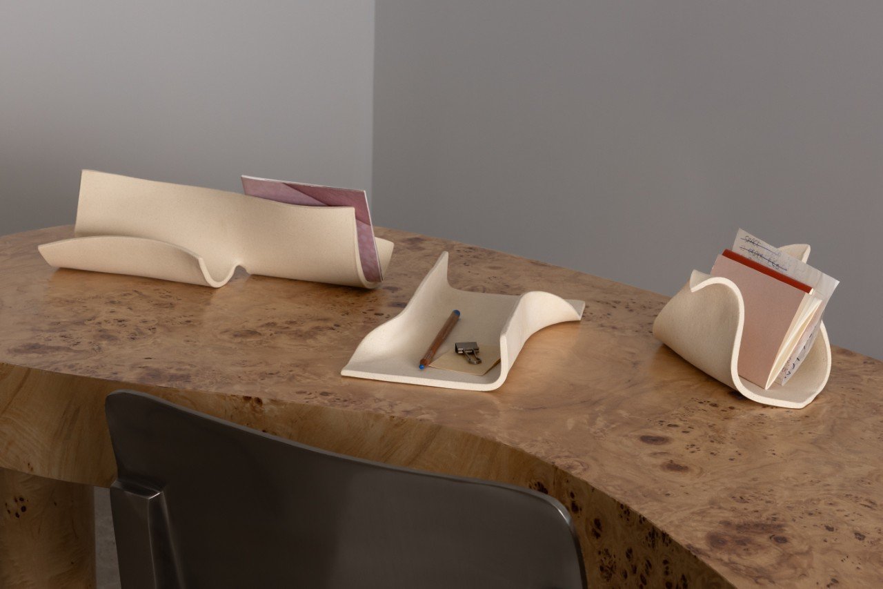 A collection of Virginia Sin's 'KEEP' ceramic organizers, including the Archiva tray, Formara, and Cache, displayed in a minimalist home setting.