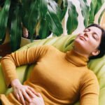 A young woman looking thoughtfully, representing proactive health choices for fertility.