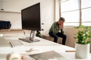 The Unspoken Burden: How Workplace Silence Costs Billions 9 An abstract image depicting the weight of unexpressed thoughts or a broken communication link in a a workplace setting.