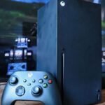 Microsoft Gaming's Seismic Shift: Phil Spencer and Sarah Bond Exit Xbox 2 Phil Spencer and Sarah Bond, former Xbox leaders, with the Xbox logo in the background, symbolizing a major leadership transition.