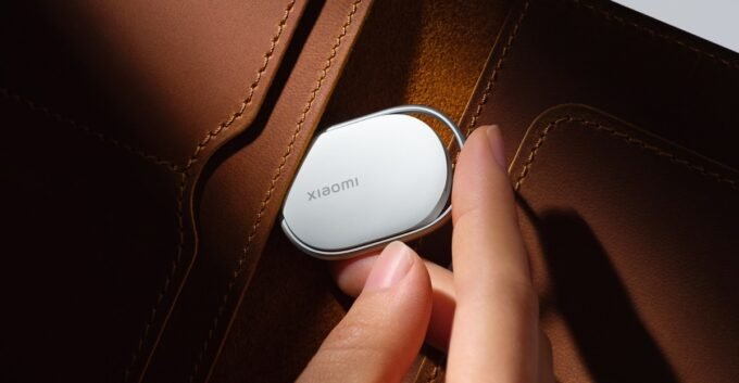Xiaomi Tag: The Smart Tracker That Clips On, No Case Needed 6 The Xiaomi Tag, an elongated Bluetooth tracker, shown with its integrated metal loop for easy attachment.