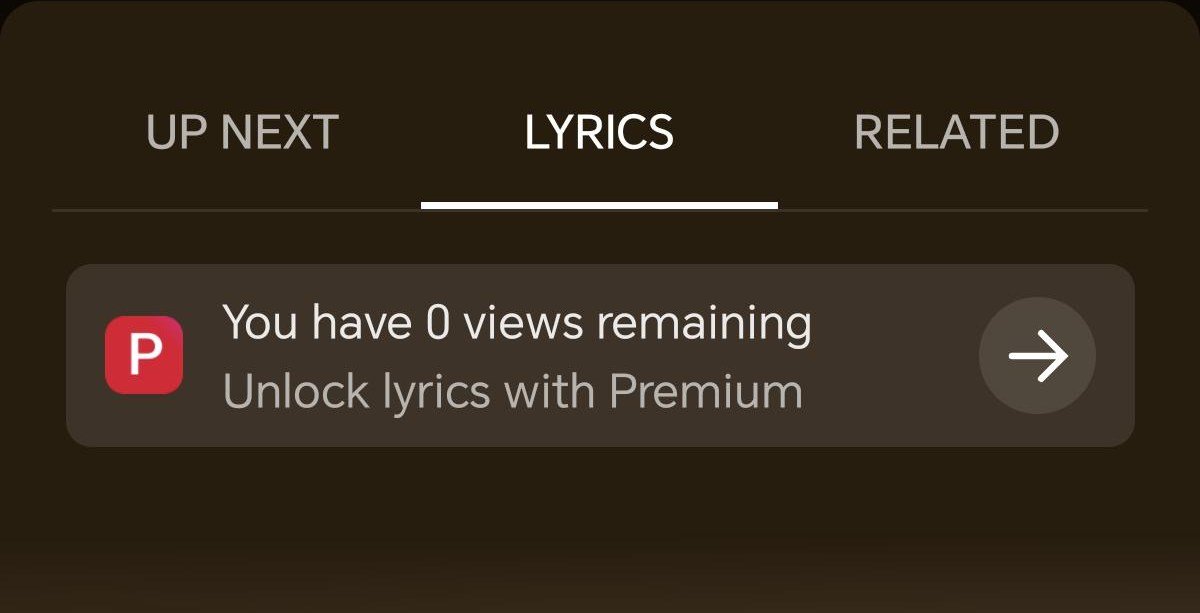 Screenshot showing blurred YouTube Music lyrics with a prompt to unlock with Premium