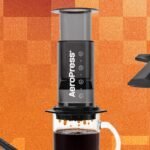 AeroPress coffee maker with a mug, ready for brewing
