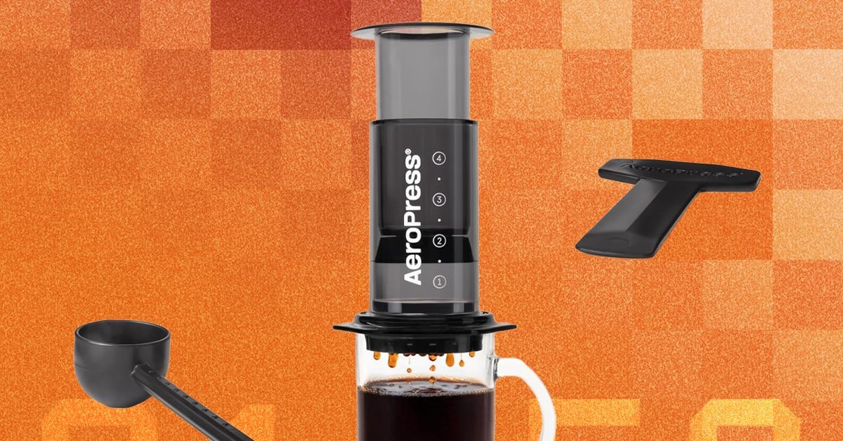 AeroPress coffee maker with a mug, ready for brewing