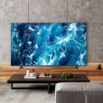 Téléviseur TCL 55T69C QLED de 55 pouces en promotion chez Carrefour, affichant une image colorée.