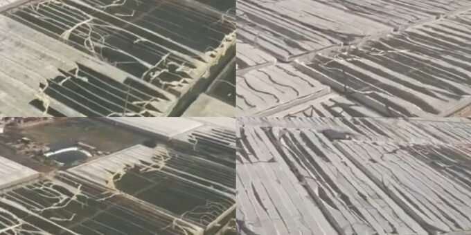 Vue aérienne des serres agricoles détruites à Chtouka-Aït Baha après la tempête, montrant des bâches arrachées et des structures effondrées.