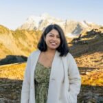 A Google engineer working at a desk with AI-related graphics in the background, symbolizing adaptation and learning.
