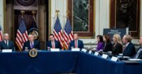 President Donald Trump with leaders of major tech companies signing a pledge at the White House, addressing data center energy demands.