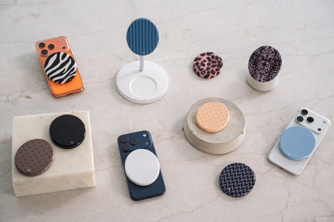 ALMA magnetic portable charger with a stylish snakeskin cover attached to a smartphone, showcasing its sleek design.