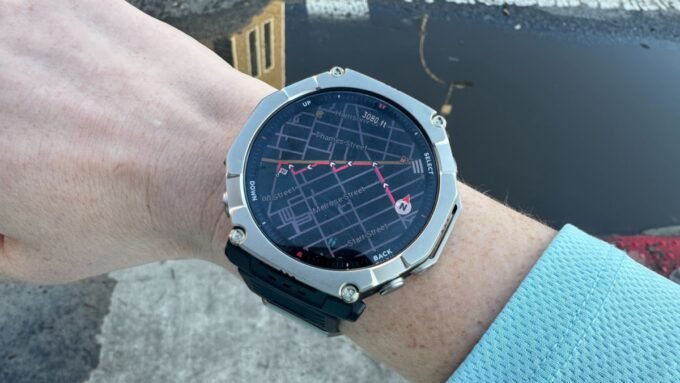 Amazfit T-Rex Ultra 2 smartwatch displaying maps and workout data on a rugged outdoor setting.