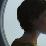 Sydney Chandler as Beck in Anima, with a retro-futuristic bob haircut.