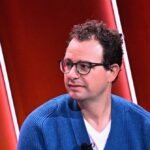 Anthropic's Claude AI logo with a backdrop of the Pentagon building, symbolizing the ongoing dispute.