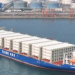 Oil tankers navigating the Strait of Hormuz with a backdrop of geopolitical tension