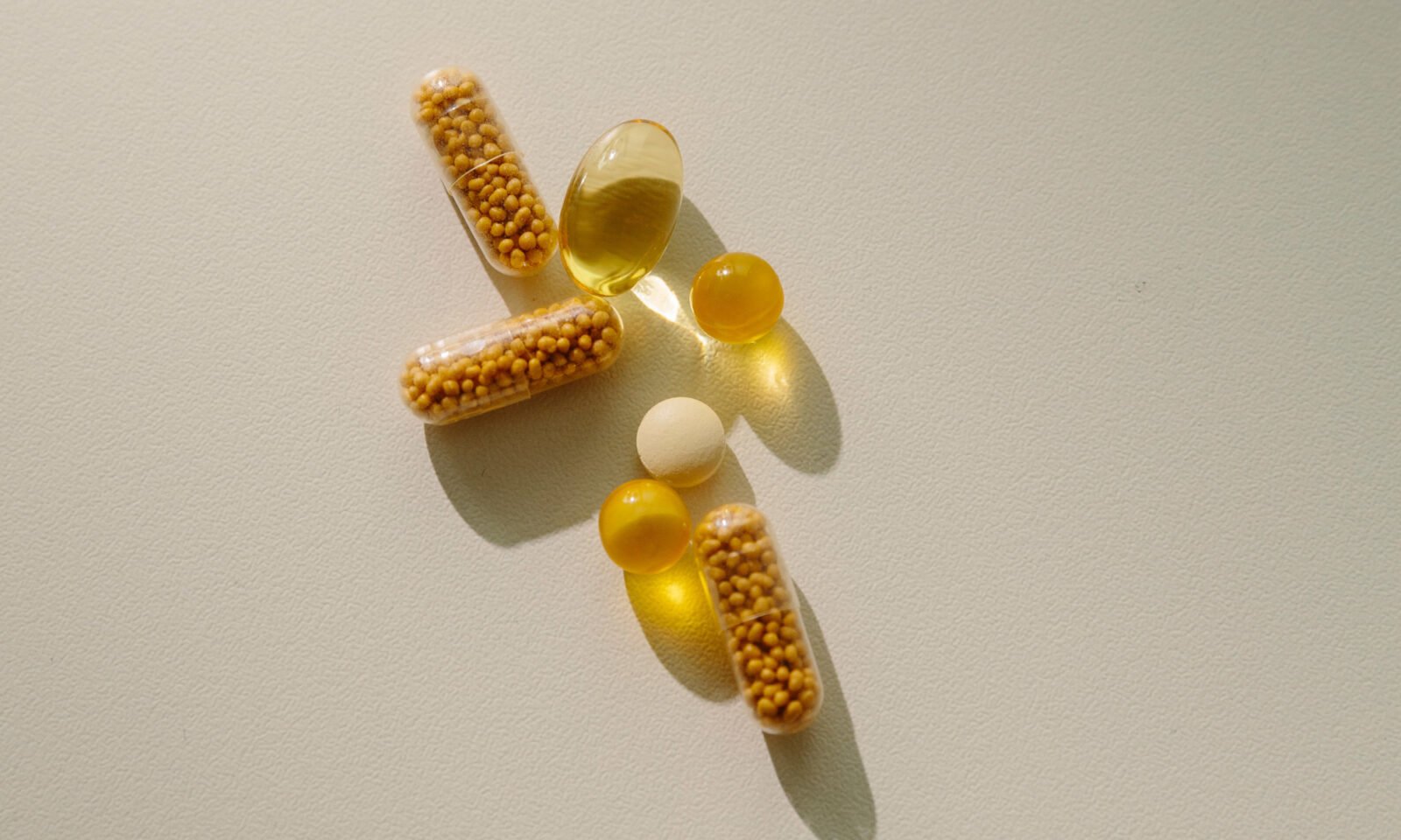 Berberine: Is It Truly 'Nature's Ozempic'? What 126 Studies Reveal About Metabolism and Gut Health 3 A plant-based supplement, possibly berberine, next to scientific research documents, symbolizing the natural vs. scientific debate.