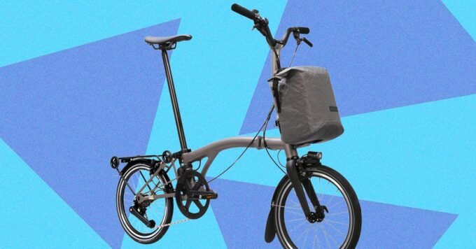 The Brompton Electric T-Line: Redefining Portable Power on Two Wheels 9 Brompton Electric T-Line folding bicycle in titanium, showcasing its compact design and electric features.