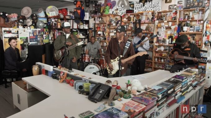 Buddy Guy and Miles Caton perform on stage with guitars at NPR's Tiny Desk Concert.